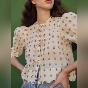 White Peplum Puff Sleeves Blouse With Blue Geometric Pattern